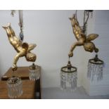 A pair and one similar 1930s pendant light fittings, fashioned as 'flying' cherubs,