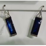 A pair of Baccarat white metal blue glass pendant earrings stamped 925 boxed 11