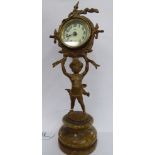 A mid 20thC 'antique' effect gilt metal cased mantel timepiece;