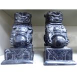 A pair of late 19th/early 20thC carved black soapstone models, Dog of Fo,