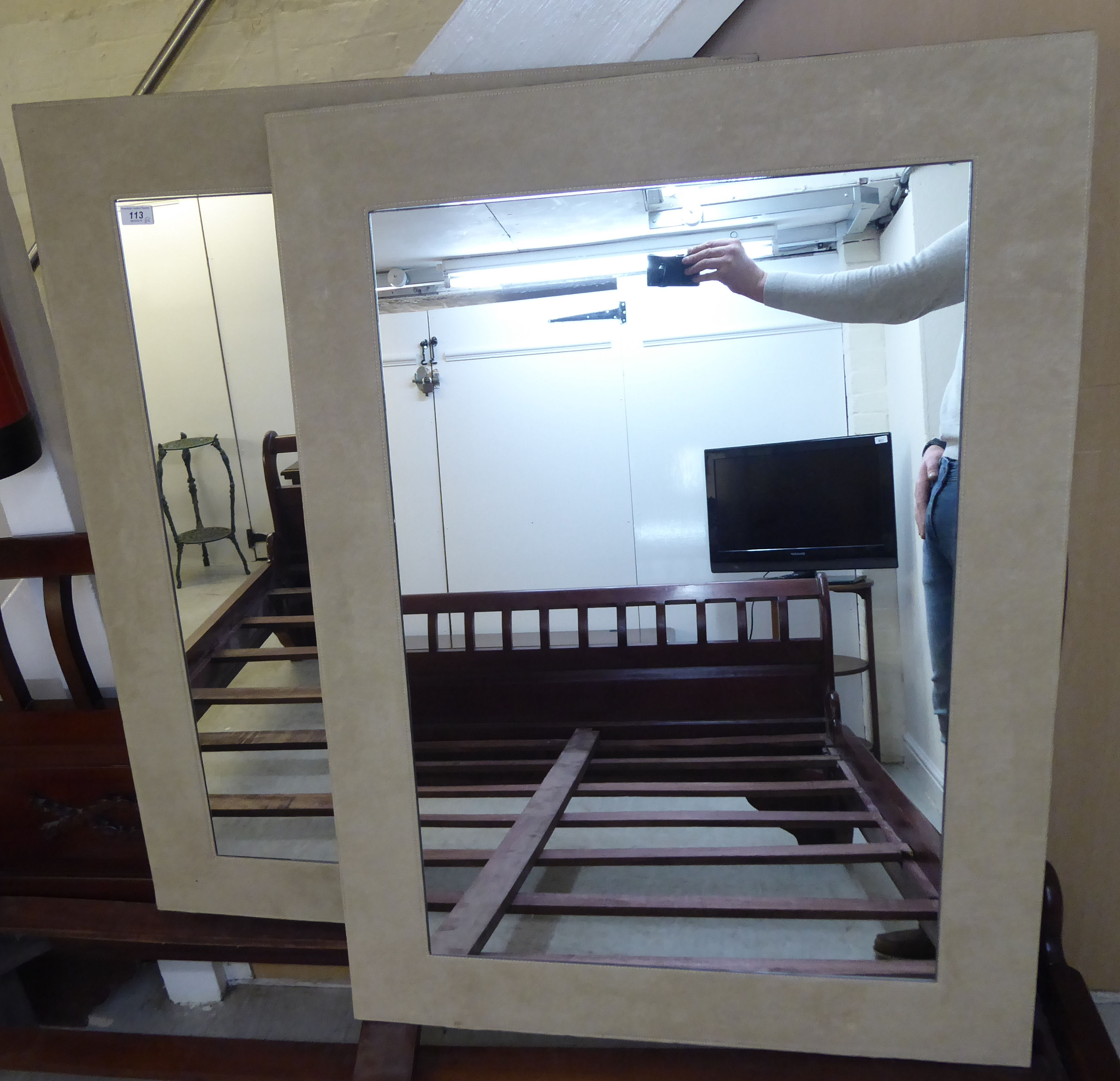 A pair of modern mirrors,