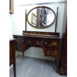 A 1930s/50s mahogany and gilded four drawer kneehole dressing table,