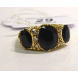 An 18ct gold claw set sapphire and diamond ring 11