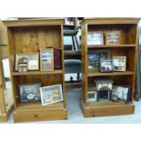 A pair of modern stained pine open front bookcases, each with three height adjustable shelves,