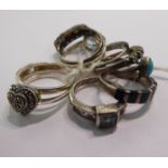 Nine white metal rings,