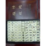 A modern Mah-Jong set with bone and bamboo tiles, in a hardwood box,