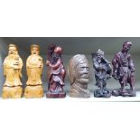 Early 20thC and later Oriental carved wooden figures: to include two standing Japanese fishermen 7.