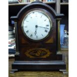 A late 19thC mahogany cased and lacquered brass mounted mantel timepiece with pillared sides and a