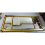 A late 19thC Regency inspired overmantel mirror, the three bevelled, in-line mirrors,