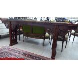 A modern Chinese lacquered elm altar table, the top with raised ends, over a carved apron,