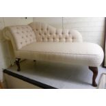 A modern chaise longue, the cream coloured part-button upholstered back,