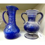 An early 20thC Venetian blue glass jug 8''h;