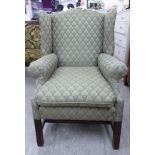 A modern Georgian style upholstered wingback armchair,