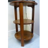 A mid 20thC mahogany three tier occasional table,