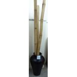 A modern Chinese design pottery vase 28''h with three bamboo poles SR