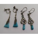 Two similar pairs of white metal earrings,