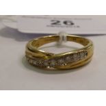 A 9ct gold crossover set diamond half eternity ring 11