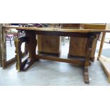 An early 20thC stained oak refectory table,