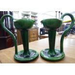 A pair of Arts & Crafts two tone green glazed pottery candlesticks, each with a deep bowl,