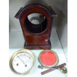 The component parts of an Edwardian mahogany cased bracket clock with straight sides and lacquered