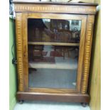 A late Victorian walnut and marquetry display cabinet with a single glazed door,