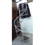 An 'antique' style, white painted iron plant stand,