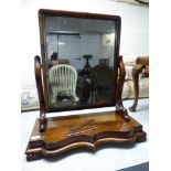 A mid Victorian toilet mirror, set in a rectangular mahogany frame,