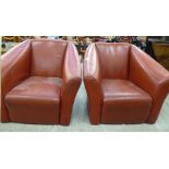 A pair of modern faux red hide upholstered tub design easy chairs CA