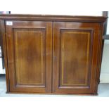 An Edwardian satinwood inlaid mahogany wall cabinet with two panelled doors 22''h 28''w SL