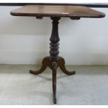 A mid 19thC mahogany pedestal table, the tip-top over a ring turned vase shaped column,