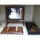 A late 19thC toilet mirror, the rectangular plate in a mahogany frame,