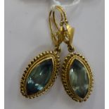 A pair of gold coloured metal and pale blue stone set,