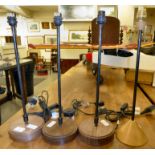 Four similar (as new) table lamps, on turned hardwood bases,
