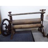 A late 19thC wrought iron and wooden mangle 16''h 22''w S