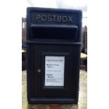 A modern black painted cast iron post box 18''h 10''w with a wall bracket CA