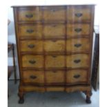 A mid 20thC mahogany and burr walnut finished chest-on-stand,