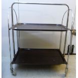 A 'vintage' Bremshey & Co Dinnett two tier tea trolley, on a folding,