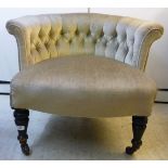 A late Victorian horseshoe shaped, button upholstered salon chair,