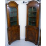 A pair of modern 19thC style mahogany finished corner cabinets,