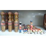 A set of nine early 20thC turned and painted wooden skittles 9''h;