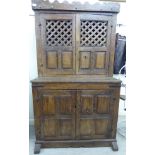 A late 17thC Spanish rustically constructed, lockable, panelled oak cupboard with iron fittings,