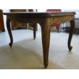 An early 20thC French oak draw leaf dining table with a parquetry top,