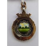 An 'antique' enamelled silver and 9ct gold pendant medallion 11