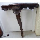 A modern mahogany serpentine front console table,