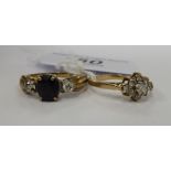Two dissimilar 9ct gold rings, one set with cubic zirconia, the other,