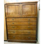 A mid 19thC mahogany linen chest with a pair of panelled doors, over five graduated drawers,