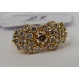 A 14ct gold claw set diamond cluster ring 11