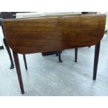 A George III mahogany Pembroke table with an end drawer and a facsimilie on the reverse,