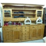 A modern honey coloured pine dresser,