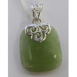 A silver coloured metal mounted green jade tablet pendant 11